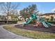Community playground with slides and climbing structures at 124 Adler Pt, Oviedo, FL 32765