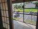 A balcony overlooking a parking lot and green space at 155 N Pearl Lake Cswy # 200, Altamonte Springs, FL 32714