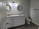 Bathroom with a double vanity, round mirrors, and tile flooring at 155 N Pearl Lake Cswy # 200, Altamonte Springs, FL 32714