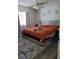 Main bedroom with plush carpet and large bed at 155 N Pearl Lake Cswy # 200, Altamonte Springs, FL 32714