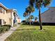 Pathway through the community with lush landscaping and palm trees at 155 N Pearl Lake Cswy # 200, Altamonte Springs, FL 32714