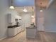 A kitchen with granite countertops, white cabinets, and tile flooring at 155 N Pearl Lake Cswy # 200, Altamonte Springs, FL 32714