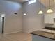 A kitchen and dining area with pendant lights and tile flooring at 155 N Pearl Lake Cswy # 200, Altamonte Springs, FL 32714