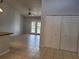 Bright room with tile floors, closet doors, and french doors that lead to the patio at 155 N Pearl Lake Cswy # 200, Altamonte Springs, FL 32714