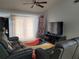Living room with TV, couches, and colorful rug at 155 N Pearl Lake Cswy # 200, Altamonte Springs, FL 32714