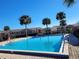 Community swimming pool with palm trees at 155 N Pearl Lake Cswy # 200, Altamonte Springs, FL 32714