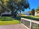 Wooden deck overlooking grassy yard and trees at 155 N Pearl Lake Cswy # 200, Altamonte Springs, FL 32714