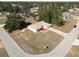 Aerial view of a tan house on a corner lot with a driveway at 16342 Sw 23Rd Court Rd, Ocala, FL 34473