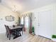 Dining area with wood table, leather chairs, and decorative mirror at 16342 Sw 23Rd Court Rd, Ocala, FL 34473