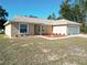 Newly built tan house with a brown roof and a two-car garage at 16342 Sw 23Rd Court Rd, Ocala, FL 34473