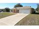 Newly built home with a long driveway and a two car garage at 16342 Sw 23Rd Court Rd, Ocala, FL 34473