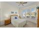 Bright bedroom with a queen-size bed and bay windows at 1807 Misty Morn Pl, Longwood, FL 32779