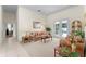 Comfortable living room with French doors opening to the pool area at 1807 Misty Morn Pl, Longwood, FL 32779