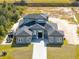 New construction home with a large lot and a paved driveway at 20344 Sheldon St, Orlando, FL 32833