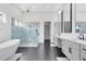 Spa-like bathroom with soaking tub, large walk-in shower, and hexagon tile floors at 20344 Sheldon St, Orlando, FL 32833