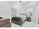 Cozy bedroom with a full-size bed, neutral decor, and ample closet space at 20344 Sheldon St, Orlando, FL 32833