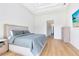 Bright bedroom with a queen-size bed, light floors, and neutral color scheme at 20344 Sheldon St, Orlando, FL 32833