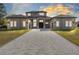 Two-story home with a paver driveway and landscaped lawn at 20344 Sheldon St, Orlando, FL 32833