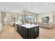 Open concept kitchen with large island and living room view at 20344 Sheldon St, Orlando, FL 32833