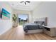 Spacious main bedroom with sliding glass doors to backyard, large bed, and light flooring at 20344 Sheldon St, Orlando, FL 32833