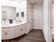 Double sink bathroom with white cabinets and a large mirror at 236 Talisi Loop, St Cloud, FL 34771