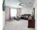 Spacious bedroom with window, crib, and dresser at 236 Talisi Loop, St Cloud, FL 34771