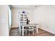 Bright dining room with a gray table, white chairs, and a china cabinet at 236 Talisi Loop, St Cloud, FL 34771