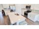 Modern kitchen with white cabinets, quartz countertops and stainless steel appliances at 236 Talisi Loop, St Cloud, FL 34771