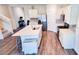 Modern kitchen with white cabinets, quartz countertops, and stainless steel appliances at 236 Talisi Loop, St Cloud, FL 34771