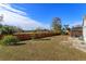 Spacious backyard with wooden fence and partial pool view at 2410 Alclobe Cir, Ocoee, FL 34761