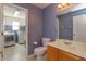 Small bathroom with single vanity and laundry access at 2410 Alclobe Cir, Ocoee, FL 34761