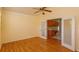 Bedroom with hardwood floors and kitchen access at 2410 Alclobe Cir, Ocoee, FL 34761