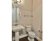 Powder room with pedestal sink and toilet at 2423 Hyatt Creek Ln, Port Orange, FL 32128