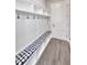 Entryway with built-in bench and storage at 2423 Hyatt Creek Ln, Port Orange, FL 32128