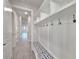 Entryway with built-in bench and storage at 2423 Hyatt Creek Ln, Port Orange, FL 32128