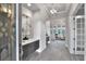 Bright and airy entryway with a spacious feel and elegant light fixture at 2423 Hyatt Creek Ln, Port Orange, FL 32128