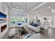 Open concept living room and kitchen with a view of the pool at 2423 Hyatt Creek Ln, Port Orange, FL 32128
