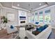 Spacious living room with fireplace, large windows, and stylish furnishings at 2423 Hyatt Creek Ln, Port Orange, FL 32128