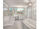 Spa-like bathroom with soaking tub and walk-in shower at 2423 Hyatt Creek Ln, Port Orange, FL 32128
