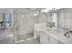 Elegant bathroom featuring a walk-in shower and double vanity at 2423 Hyatt Creek Ln, Port Orange, FL 32128