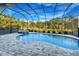 Resort-style pool and spa with screened enclosure at 2423 Hyatt Creek Ln, Port Orange, FL 32128