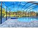 Relaxing pool and spa area with a screened enclosure at 2423 Hyatt Creek Ln, Port Orange, FL 32128