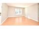 Living room with wood flooring and large window at 2519 Kilgore St # 203, Orlando, FL 32803