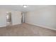 Spacious bedroom with carpeted floor and access to bathroom at 2741 Pleasant Cypress Cir, Kissimmee, FL 34741