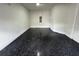 Garage with epoxy flooring and storage at 2741 Pleasant Cypress Cir, Kissimmee, FL 34741