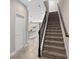 Interior view of a carpeted staircase with wrought iron balusters at 2741 Pleasant Cypress Cir, Kissimmee, FL 34741