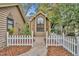 Brick walkway to the front door, framed by a white picket fence at 276 E Long Creek Cv, Longwood, FL 32750