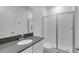 Clean bathroom with a walk-in shower and gray countertop at 3087 Camden Way, Davenport, FL 33837