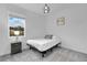 Cozy bedroom with a queen-size bed and window seat at 3087 Camden Way, Davenport, FL 33837