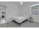Small bedroom with a queen-size bed and access to another room at 3087 Camden Way, Davenport, FL 33837